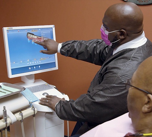 Dentist and patient looking at digital smile design