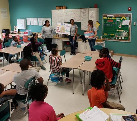 Dental team member presenting to classroom