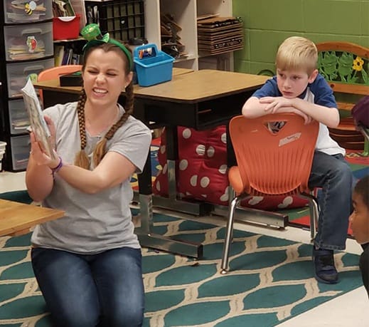 Dental team member reading to child