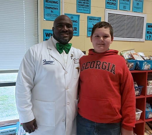 Doctor Marable and young patient taking picture