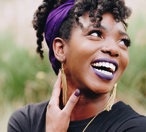 Woman with metal free dental crown smiling