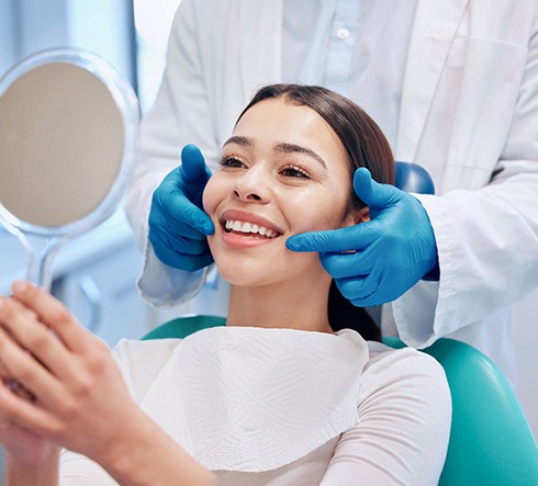 A patient who just received dental crown treatment