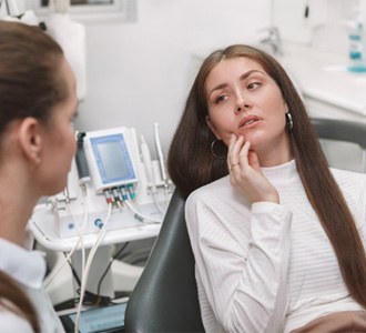 woman at dental checkup for cost of emergency dentistry in Fort Valley