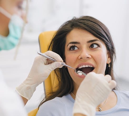 Patient receiving tooth extraction