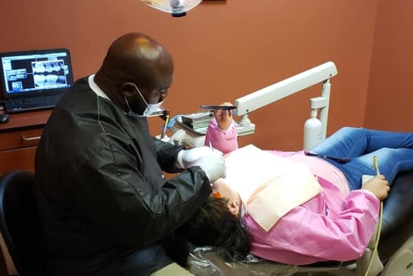 Doctor Marable providing emergency dentistry treatment