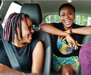 Two women laughing after preventive dentistry visit