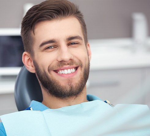 Man with healthy smile after periodontal therapy