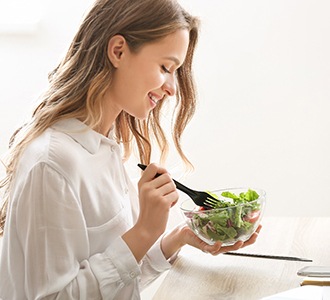 woman eating salad 