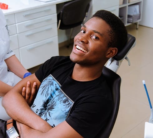 Man smiling during dental checkup and teeth cleaning visit