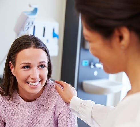 Relaxed patient laughing during sedation dentistry visit