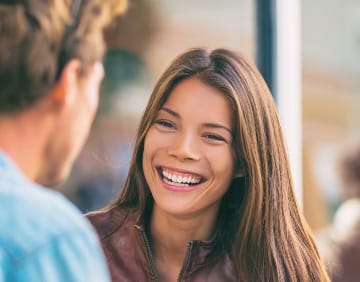 Woman with beautiful smile after cosmetic dentistry