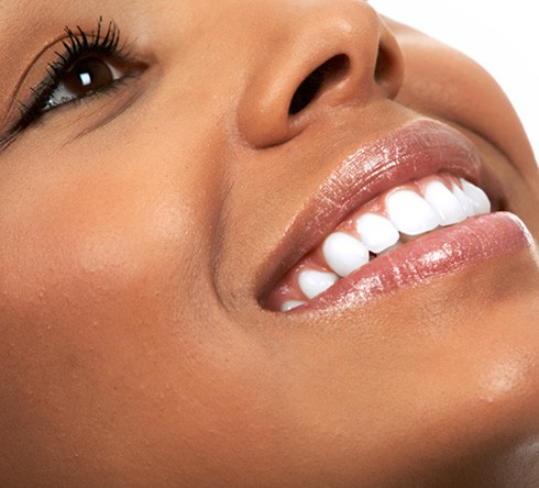 ¾ Nose-to-chin profile view of woman smiling