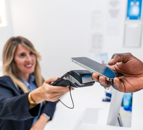 Someone paying for service with smartphone