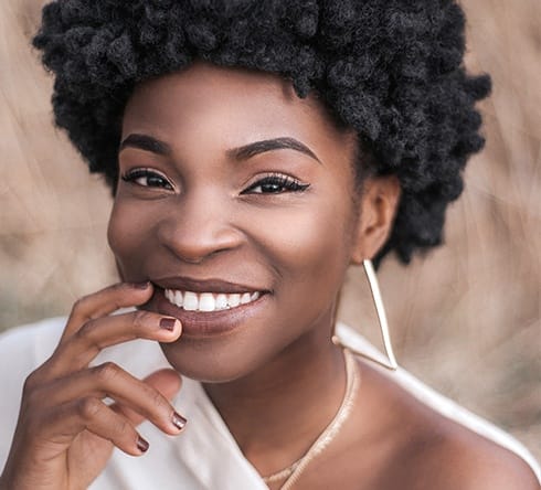 Woman with bright smile after teeth whitening