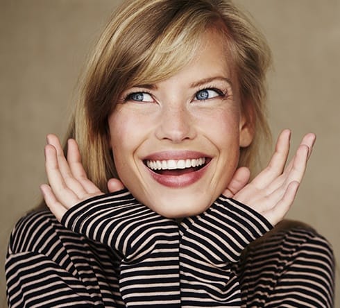 Woman showing off smile after teeth whitening