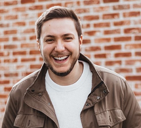 Young man laughing after wisdom tooth extraction