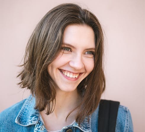 Woman sharing healthy smile after wisdom tooth extraction