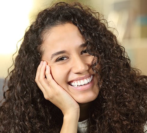 Laughing young woman after wisdom tooth extraction