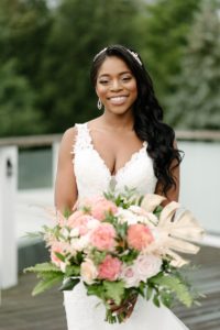 smiling bride with flowers