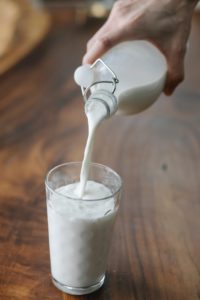 Milk being poured into a glass