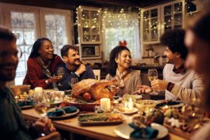 a family eating Thanksgiving dinner together