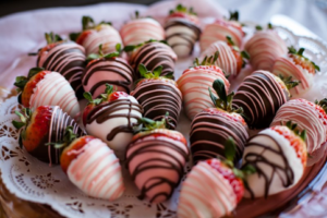 Chocolate-covered strawberries arranged on a plate 