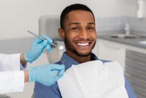 Man smiling after getting his cavity treated 